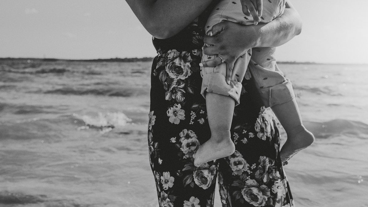 woman in black and white floral dress